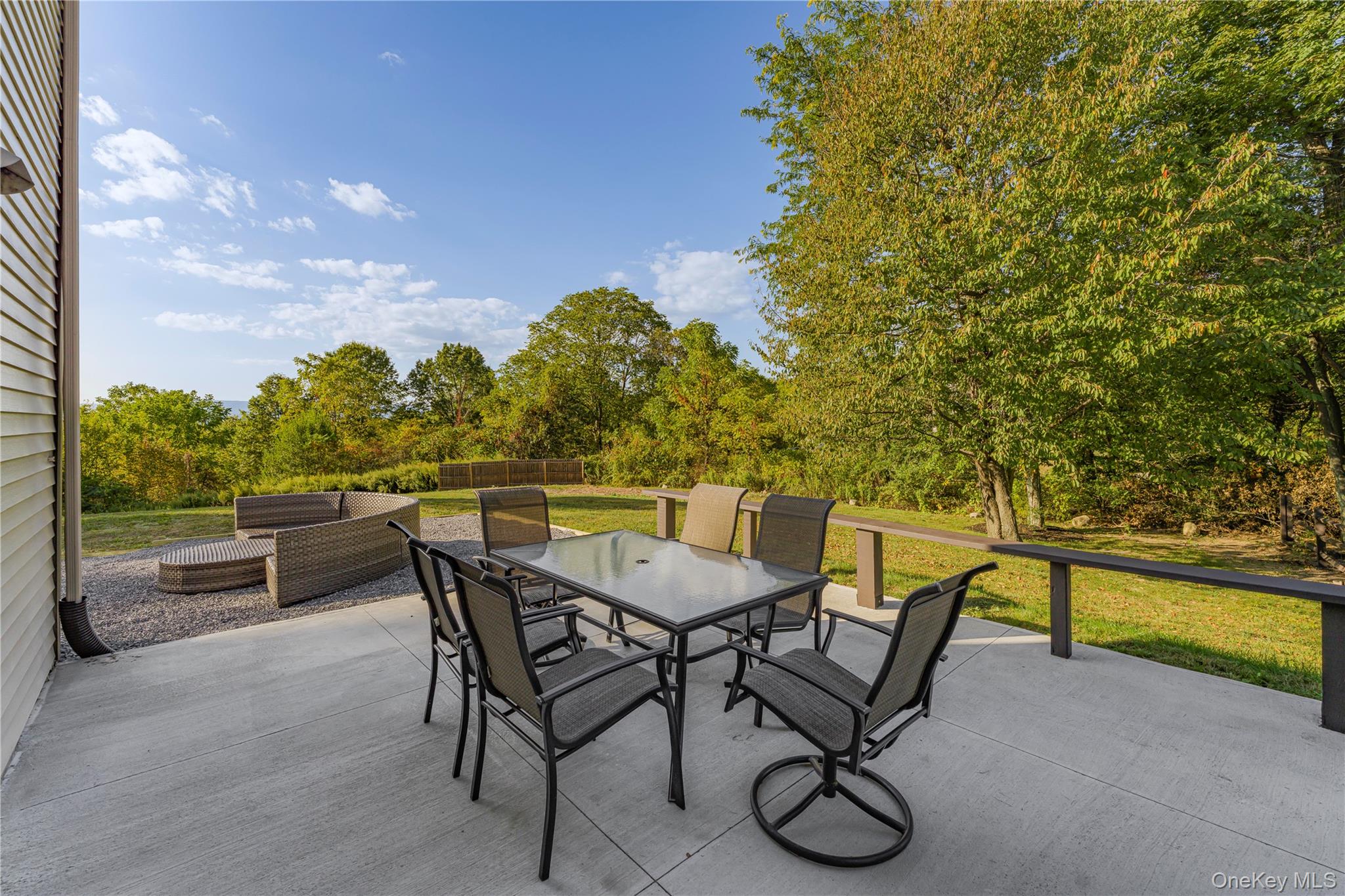 17 Brendella Court Wallkill, NY 12589 - Photo 22 of 39 View of patio / terrace featuring outdoor dining space, an outdoor hangout area, and view of wooded area