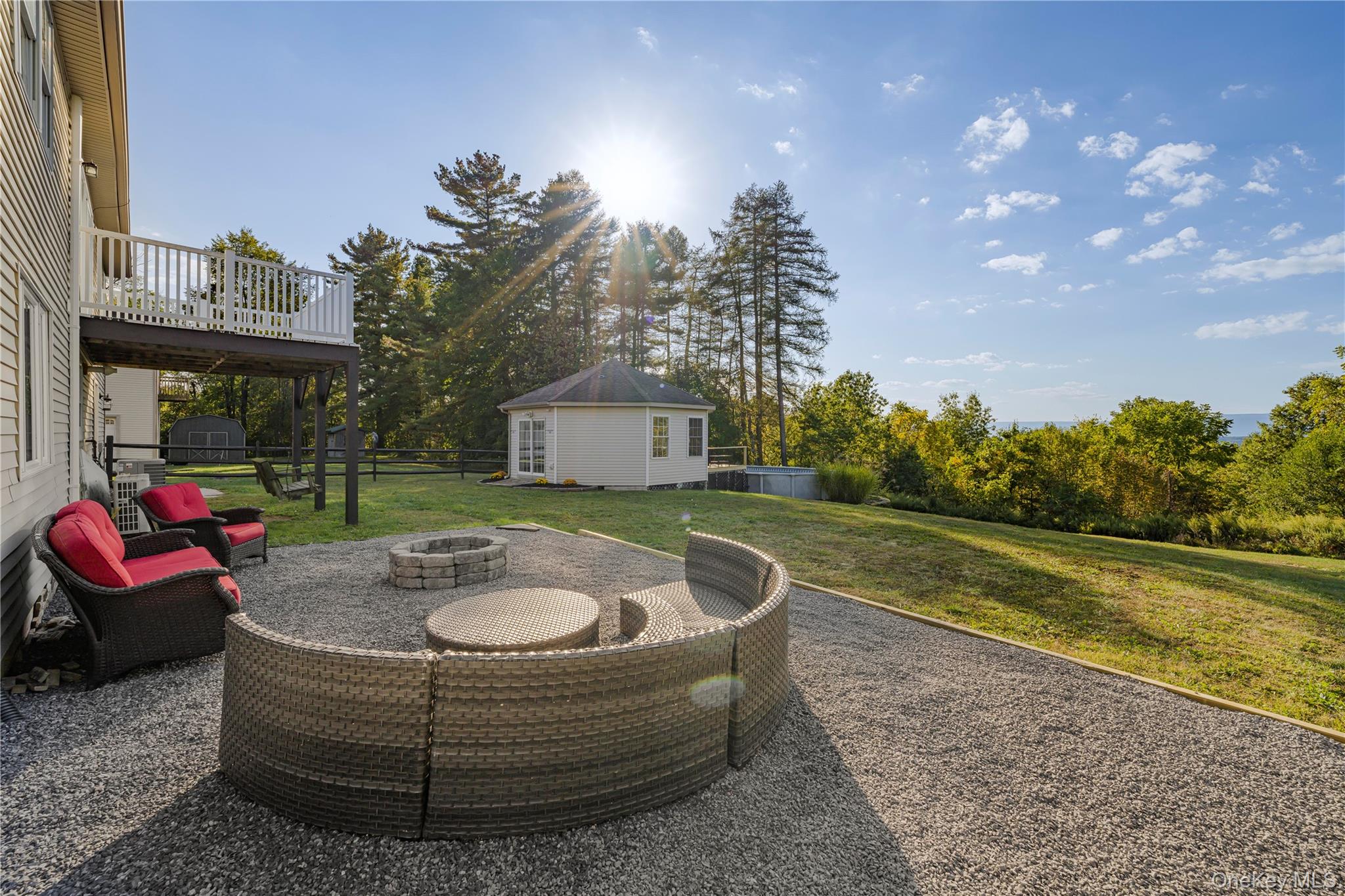 17 Brendella Court Wallkill, NY 12589 - Photo 23 of 39 View of patio featuring an outbuilding, a fire pit, and view of wooded area