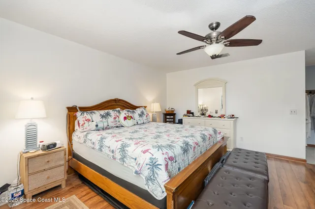 a bedroom with a bed and cabinet