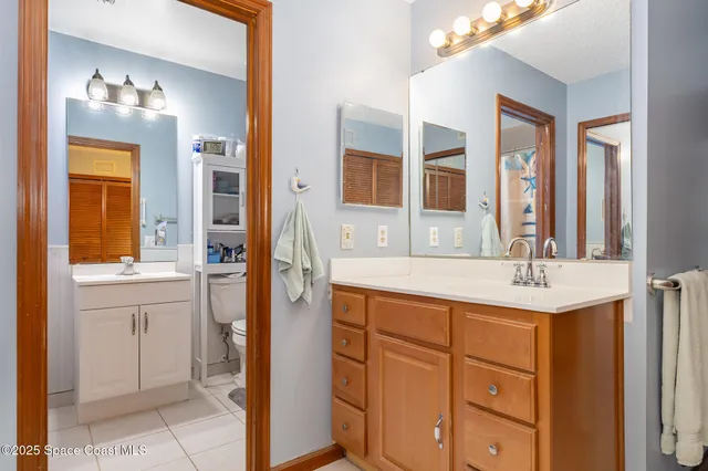 a bathroom with a sink double vanity and a mirror