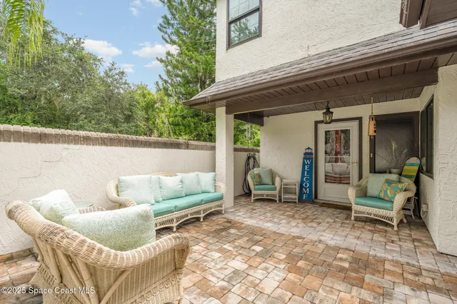 a view of living room filled with furniture and a potted plant