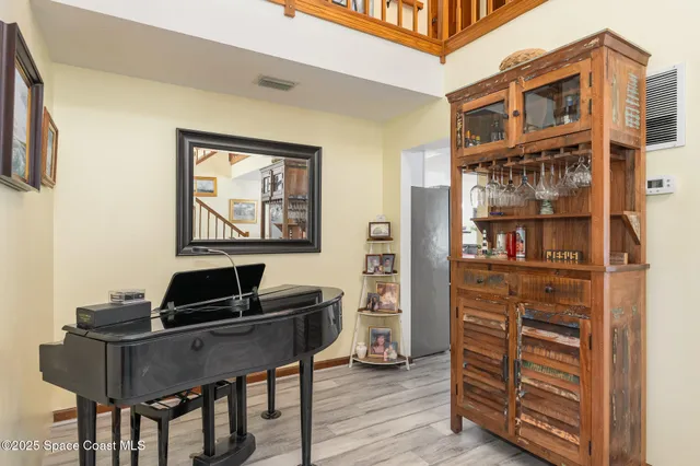 a living room with furniture and a bookshelf