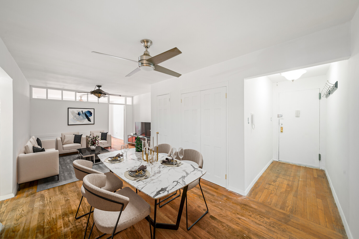 310 Lenox Road, Unit 4U Brooklyn, NY 11226 - Photo 2 of 4 a living room with furniture and a wooden floor