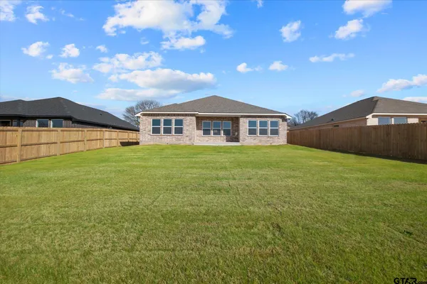 a view of a house with a big yard