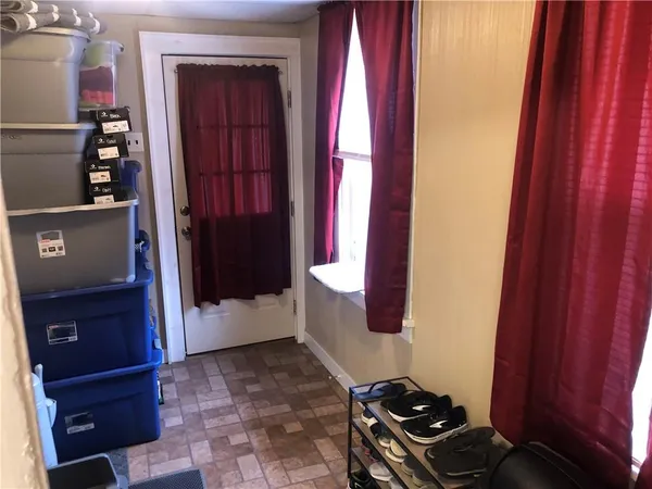 a kitchen with a refrigerator and a stove