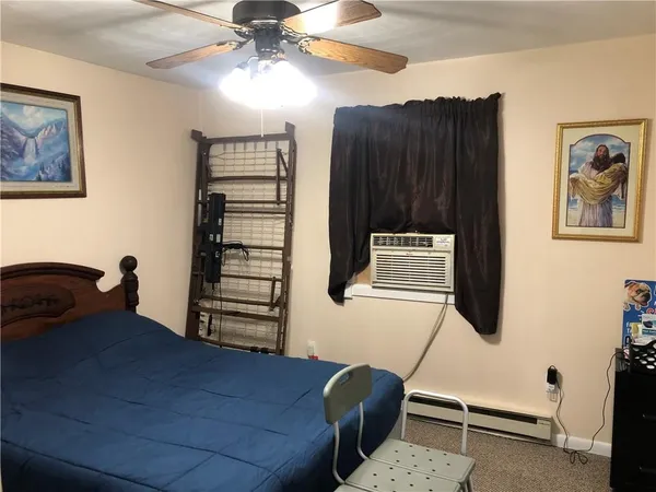 a bedroom with a bed and furniture