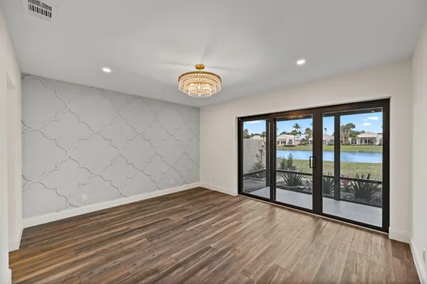 a bathroom with a granite countertop mirror and a sink
