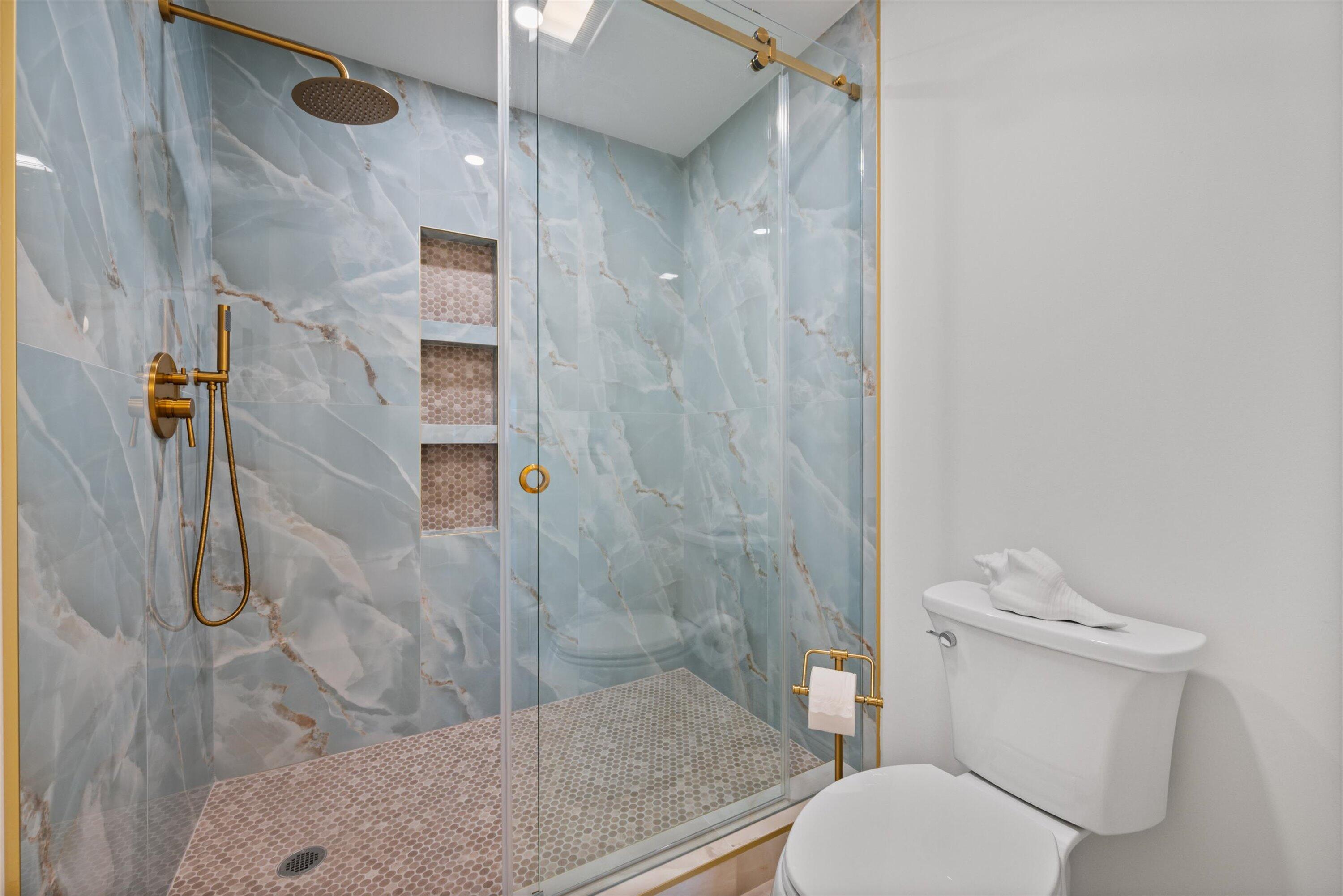 3733 Cape Pointe Circle Jupiter, FL 33477 - Photo 19 of 63 a bathroom with a toilet and a shower