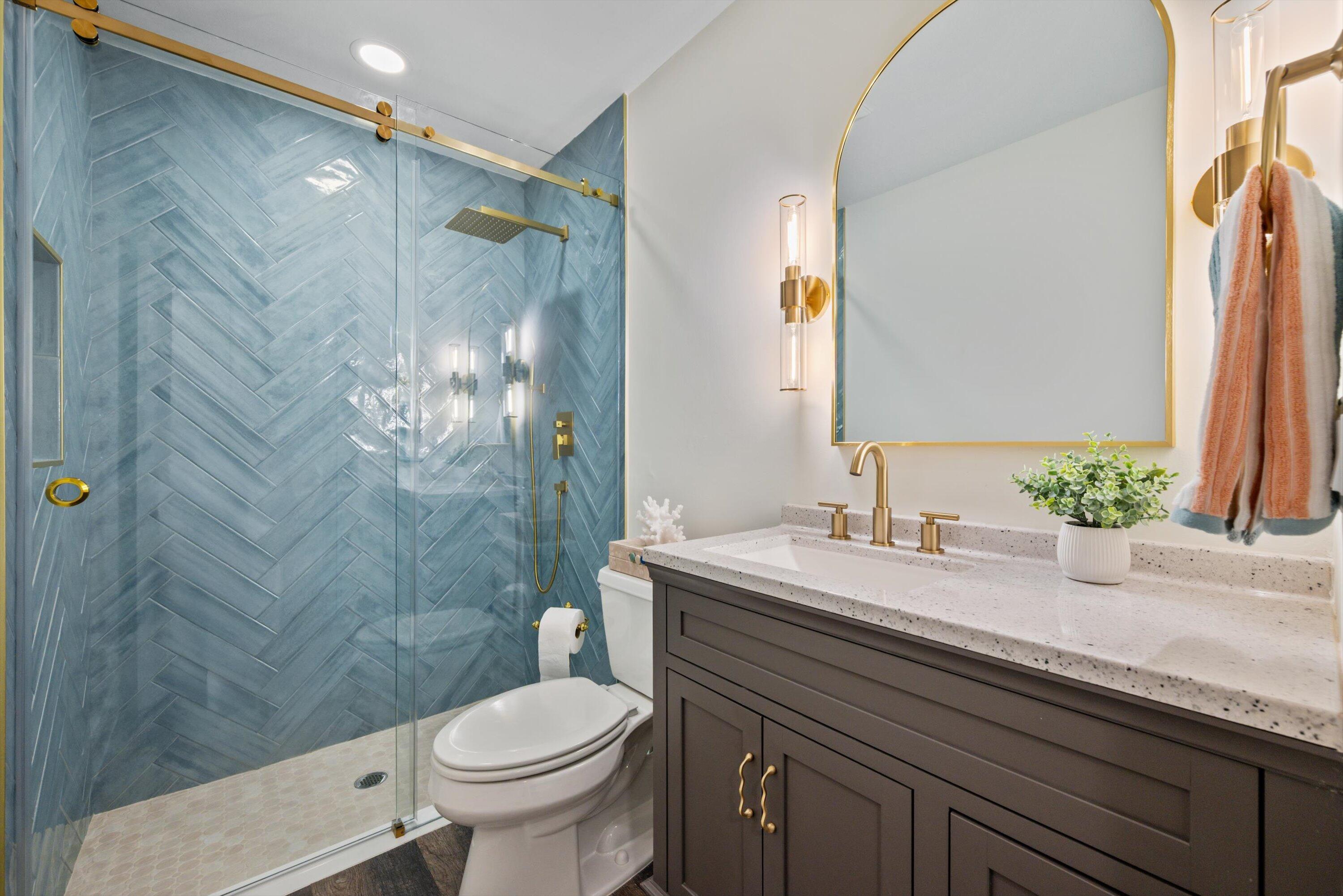 3733 Cape Pointe Circle Jupiter, FL 33477 - Photo 24 of 63 a bathroom with a granite countertop sink toilet and shower