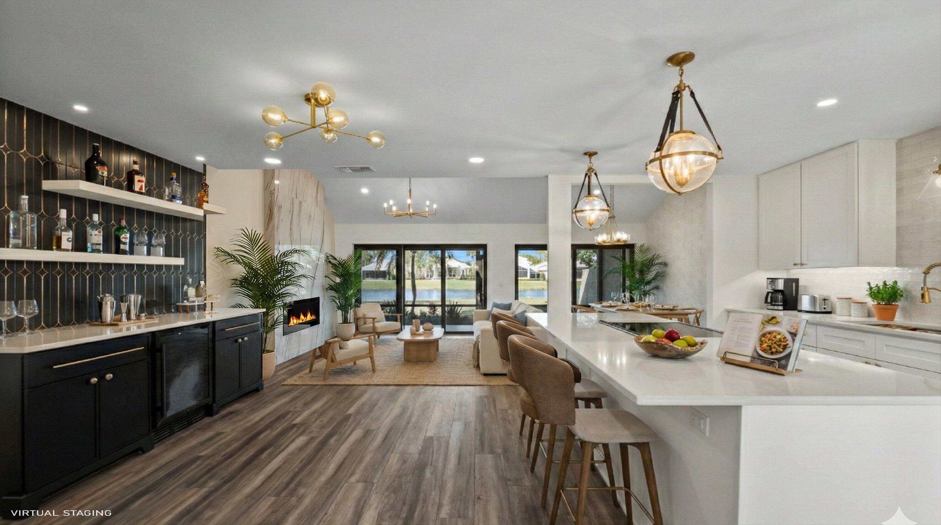 3733 Cape Pointe Circle Jupiter, FL 33477 - Photo 29 of 63 a kitchen with sink cabinets and living room