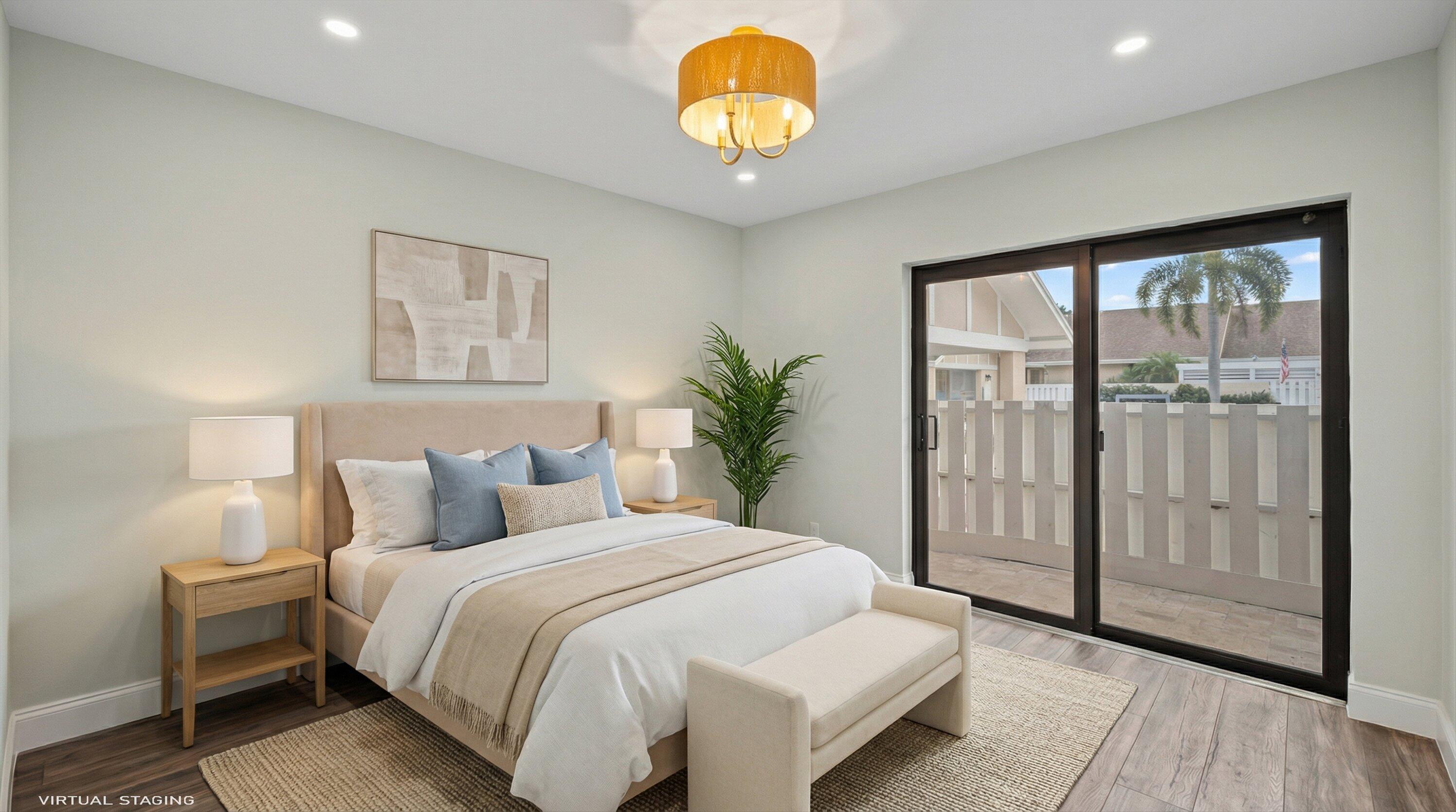 3733 Cape Pointe Circle Jupiter, FL 33477 - Photo 33 of 63 a bedroom with a bed and a painting on the wall