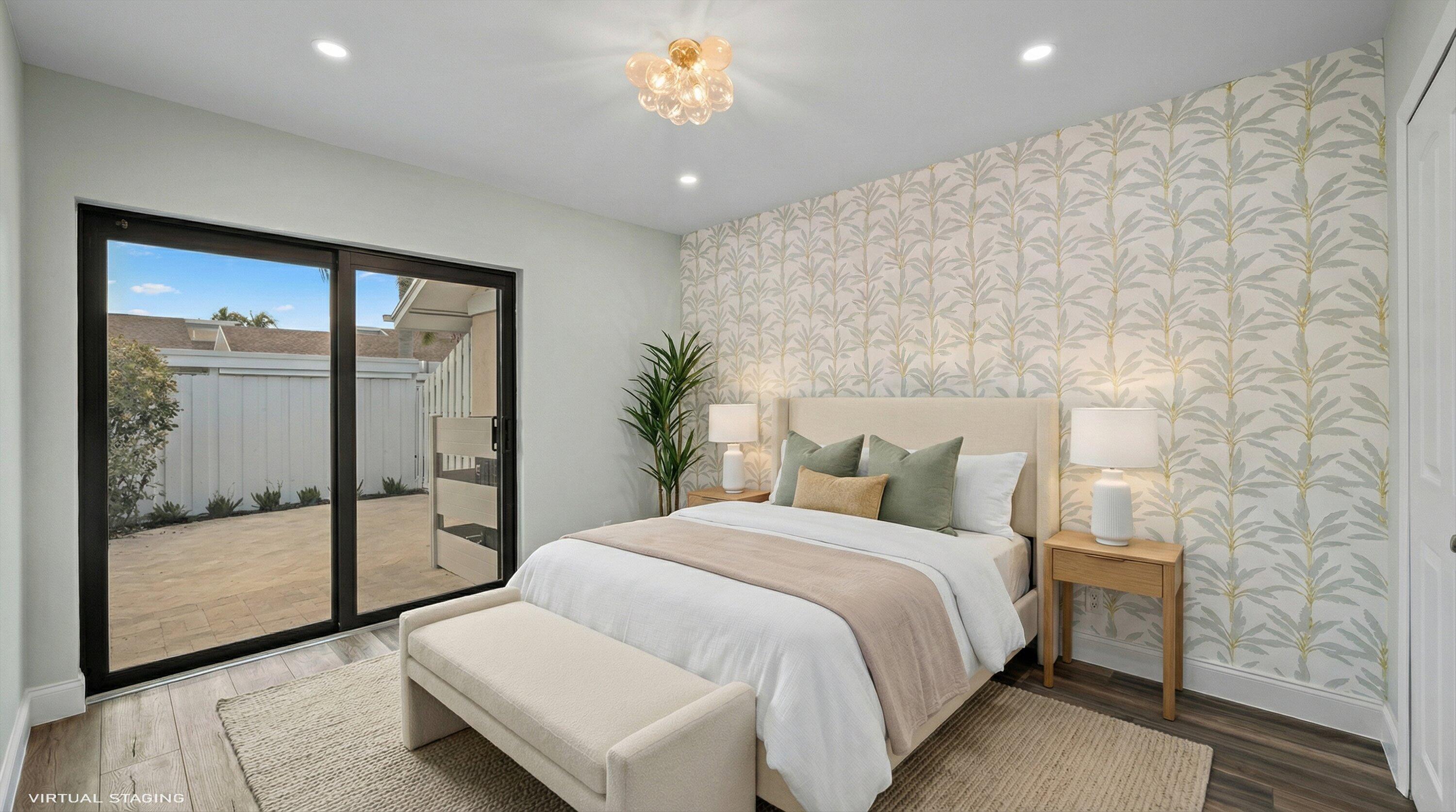 3733 Cape Pointe Circle Jupiter, FL 33477 - Photo 36 of 63 a bedroom with a large bed and a chandelier