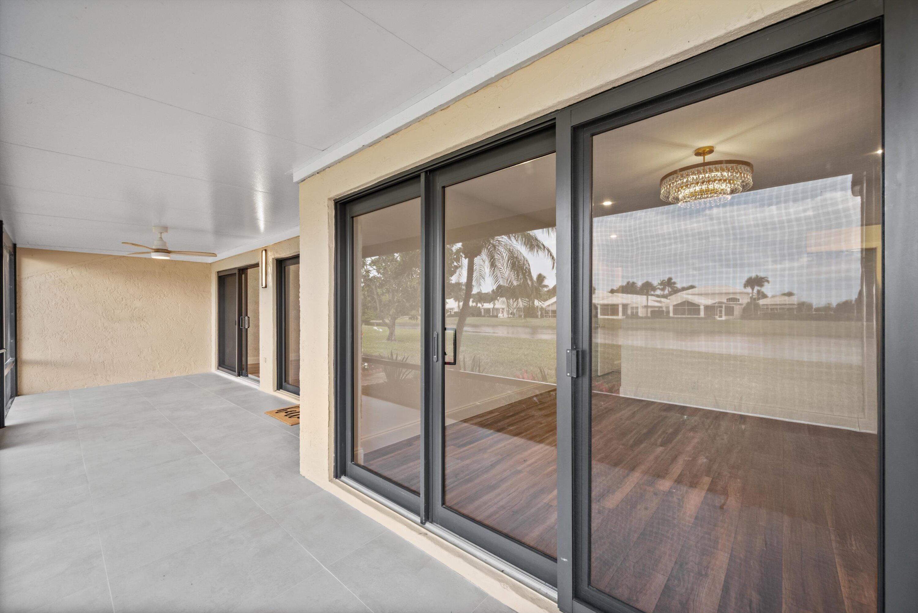 3733 Cape Pointe Circle Jupiter, FL 33477 - Photo 49 of 63 a view of a glass door