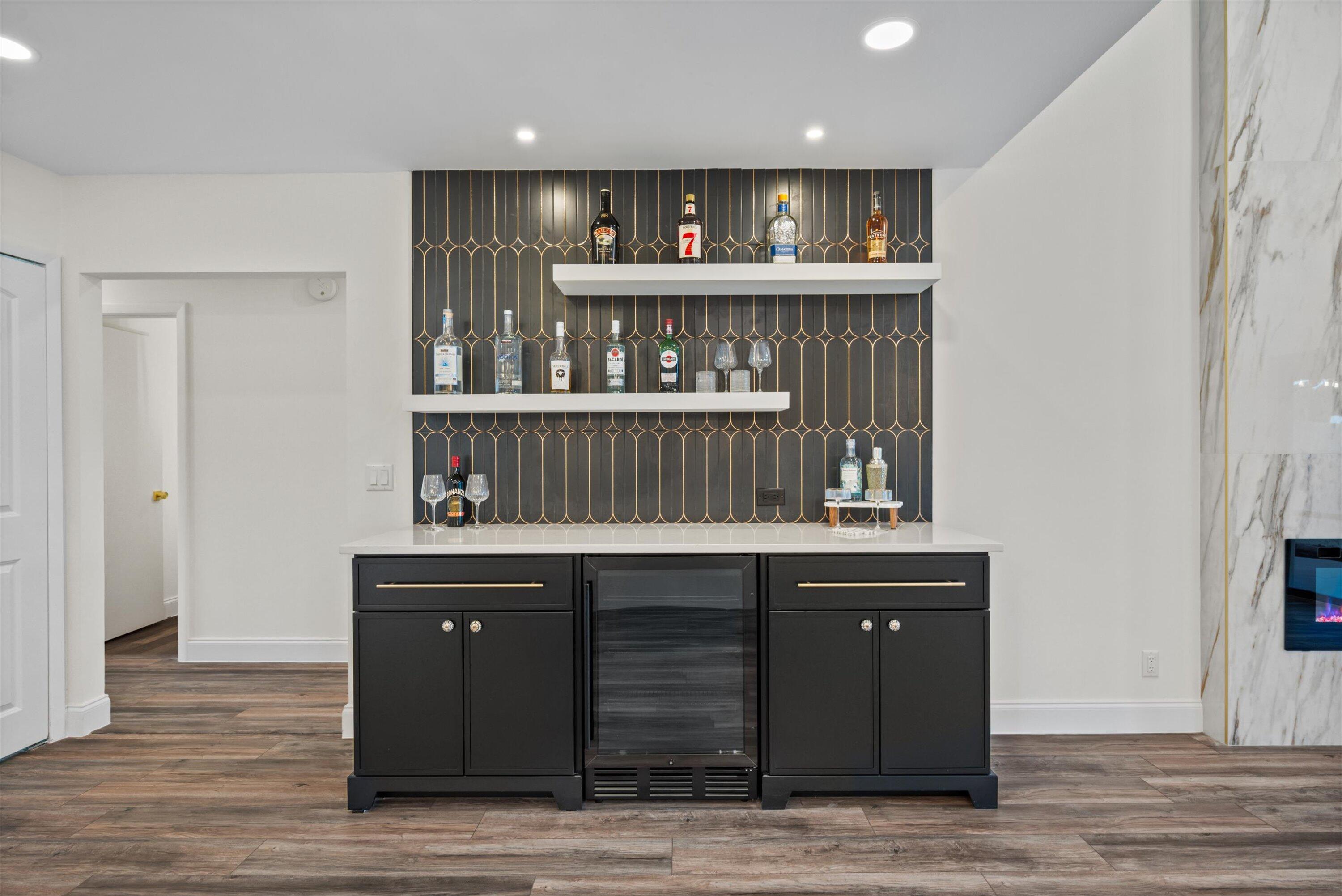 3733 Cape Pointe Circle Jupiter, FL 33477 - Photo 6 of 63 a view of kitchen cabinets and wooden floor