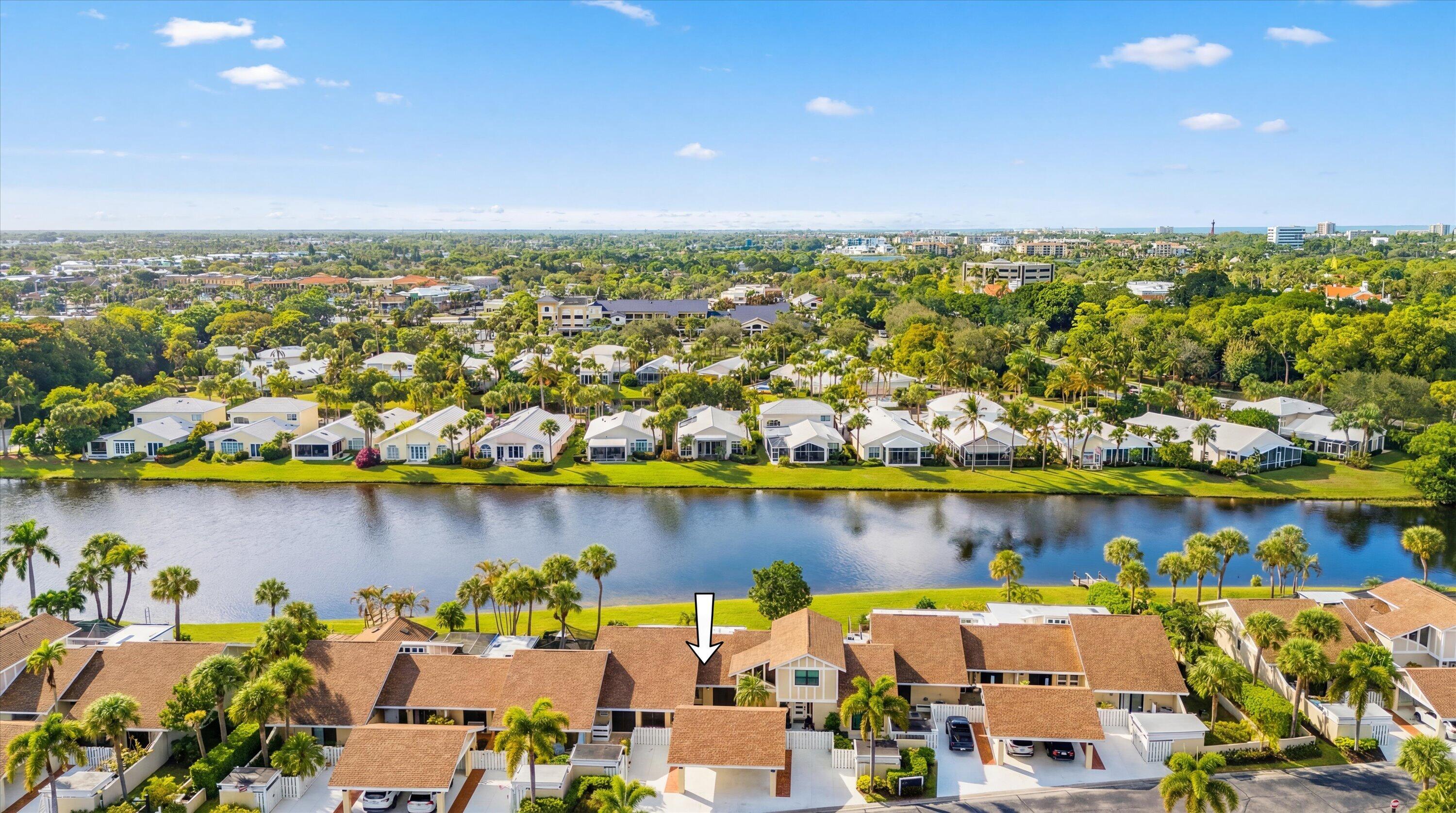3733 Cape Pointe Circle Jupiter, FL 33477 - Photo 62 of 63 an aerial view of a city with houses