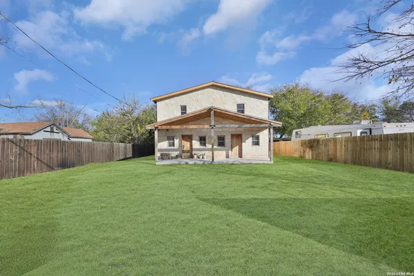 a view of a house with a big yard