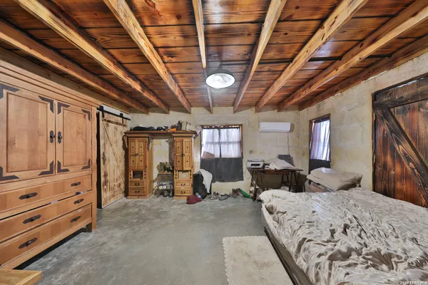 a bed room with a bed and a chandelier