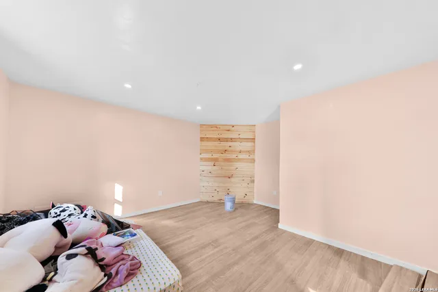 a living room with hard wood flooring and a couch