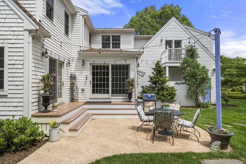 30 Franklin Rodgers Road Hingham, MA 02043 - Photo 30 of 37 a view of a house with backyard sitting area and garden