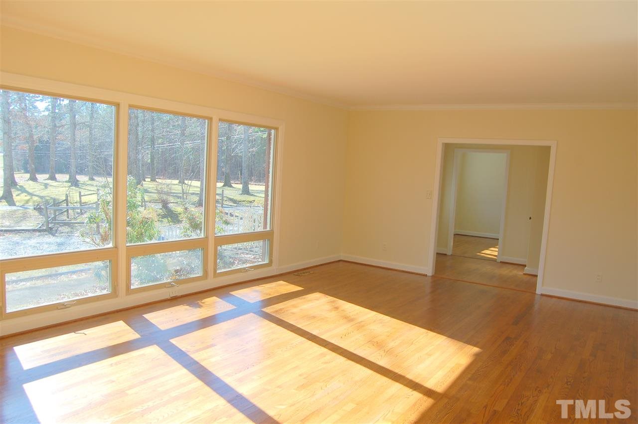 409 Goodwin Road Durham, NC 27712 - Photo 4 of 25 a view of an empty room and window