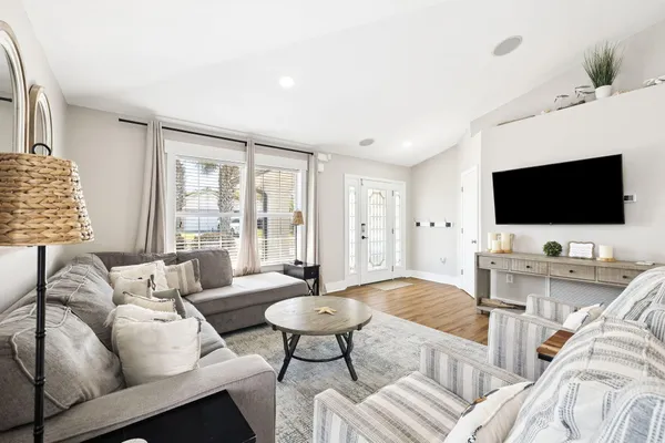 a living room with furniture and a flat screen tv