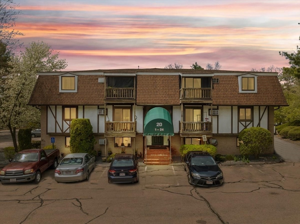 a front view of a house with parking area