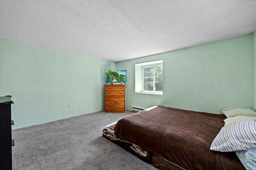 20 Erick Road, Unit 18 Mansfield, MA 02048 - Photo 11 of 21 a bedroom with a bed and a window