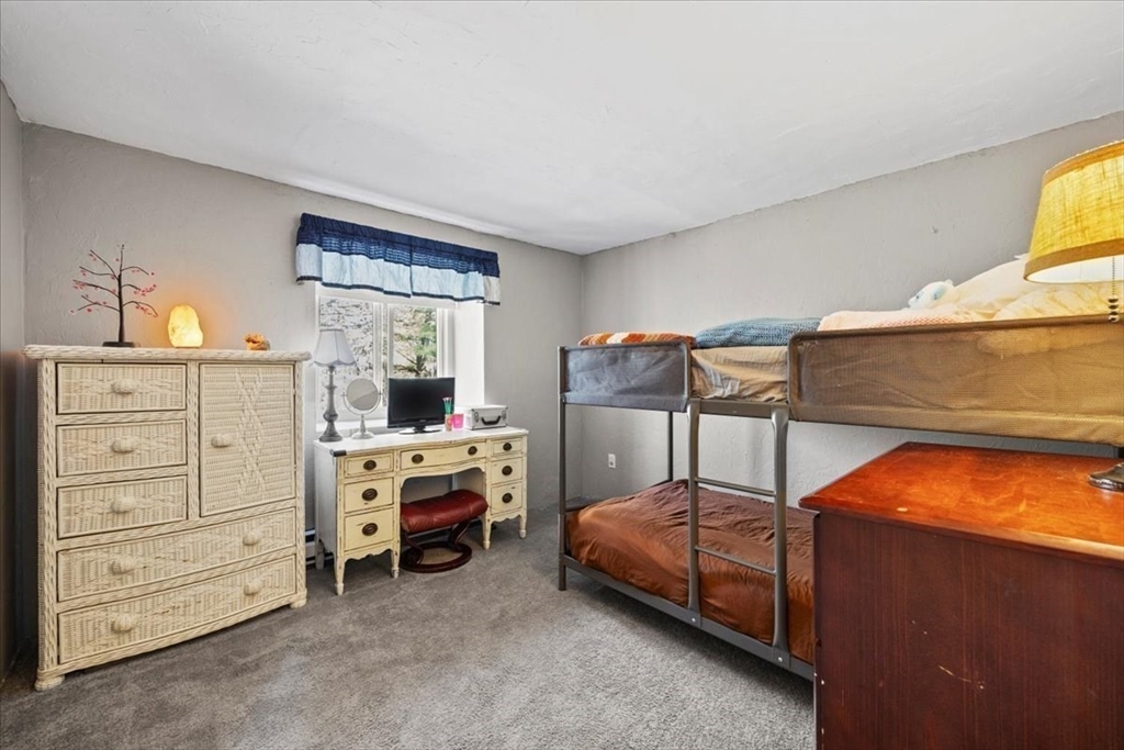 20 Erick Road, Unit 18 Mansfield, MA 02048 - Photo 13 of 21 a bedroom with a bed and a tv