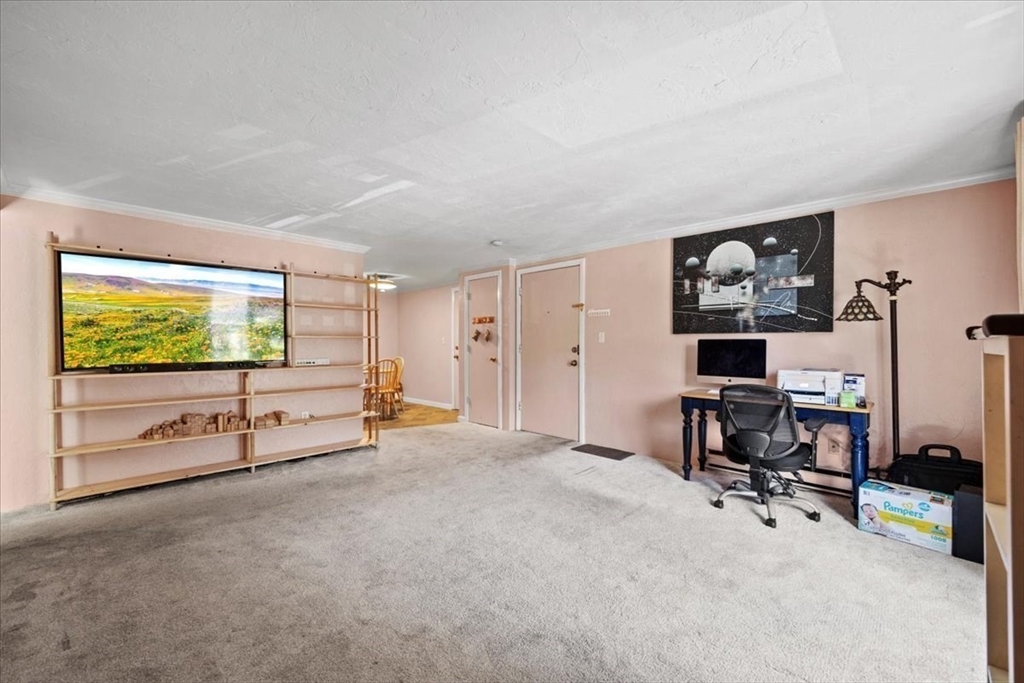20 Erick Road, Unit 18 Mansfield, MA 02048 - Photo 3 of 21 a view of a livingroom with workspace and windows