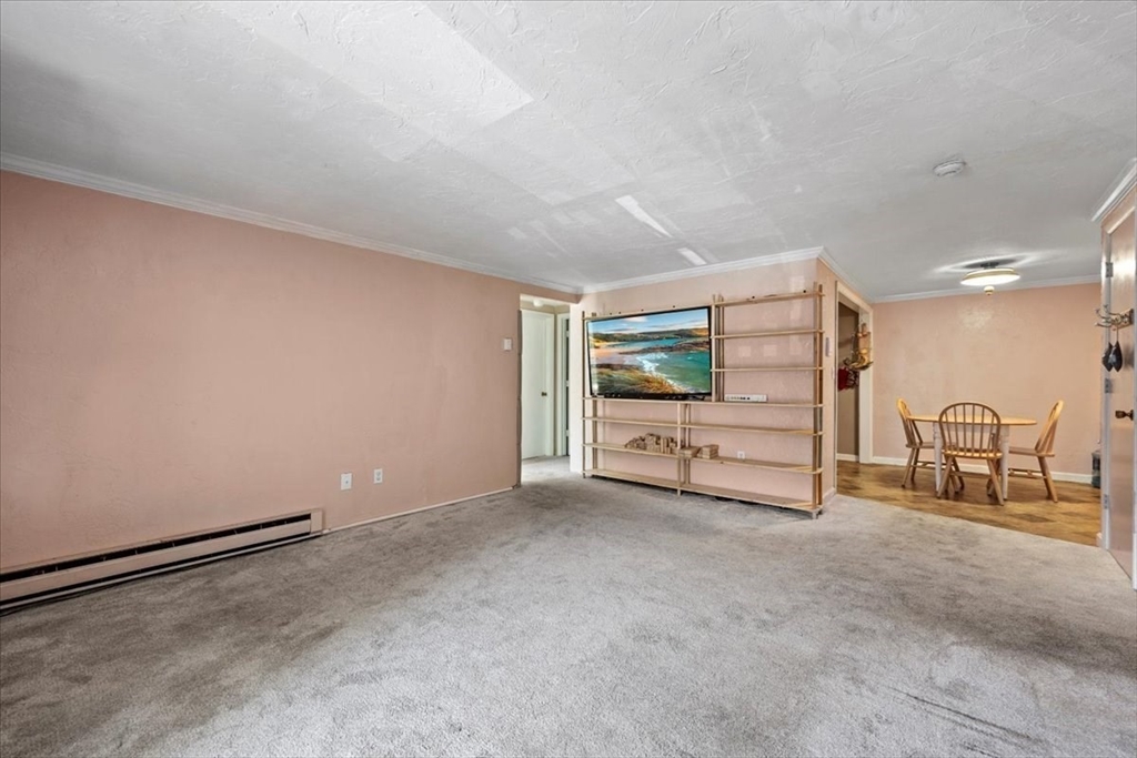 20 Erick Road, Unit 18 Mansfield, MA 02048 - Photo 5 of 21 a view of a livingroom with couch