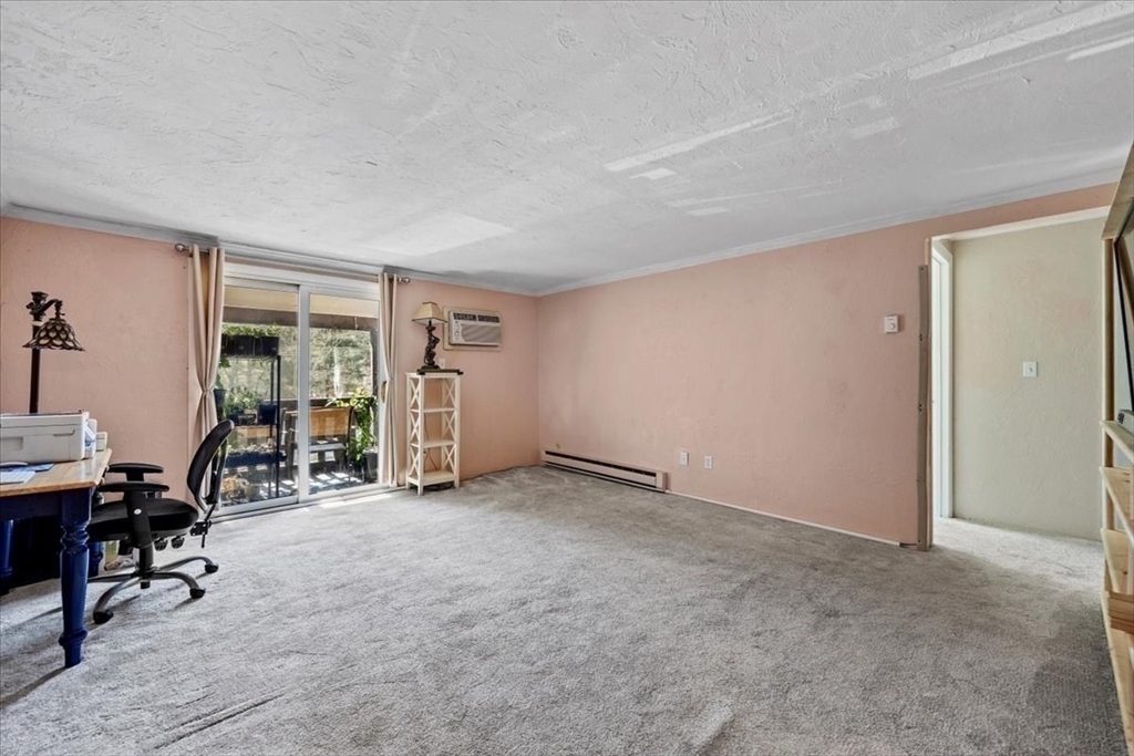20 Erick Road, Unit 18 Mansfield, MA 02048 - Photo 6 of 21 a view of a livingroom with entryway and workspace
