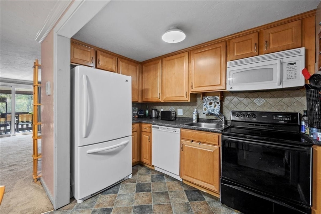 20 Erick Road, Unit 18 Mansfield, MA 02048 - Photo 8 of 21 a kitchen with a refrigerator stove and sink