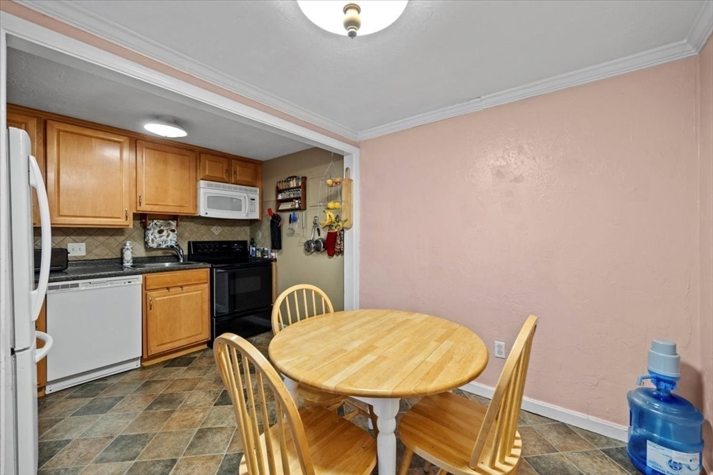 20 Erick Road, Unit 18 Mansfield, MA 02048 - Photo 9 of 21 a kitchen with a sink cabinets and appliances