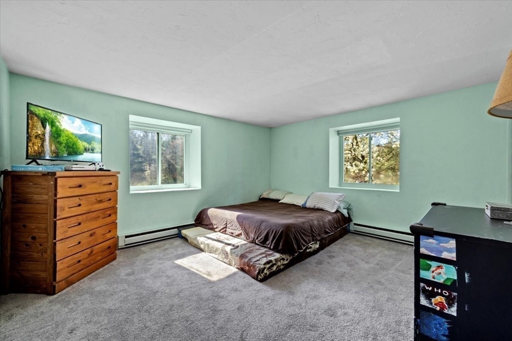 20 Erick Road, Unit 18 Mansfield, MA 02048 - Photo 10 of 21 a living room with furniture and a window