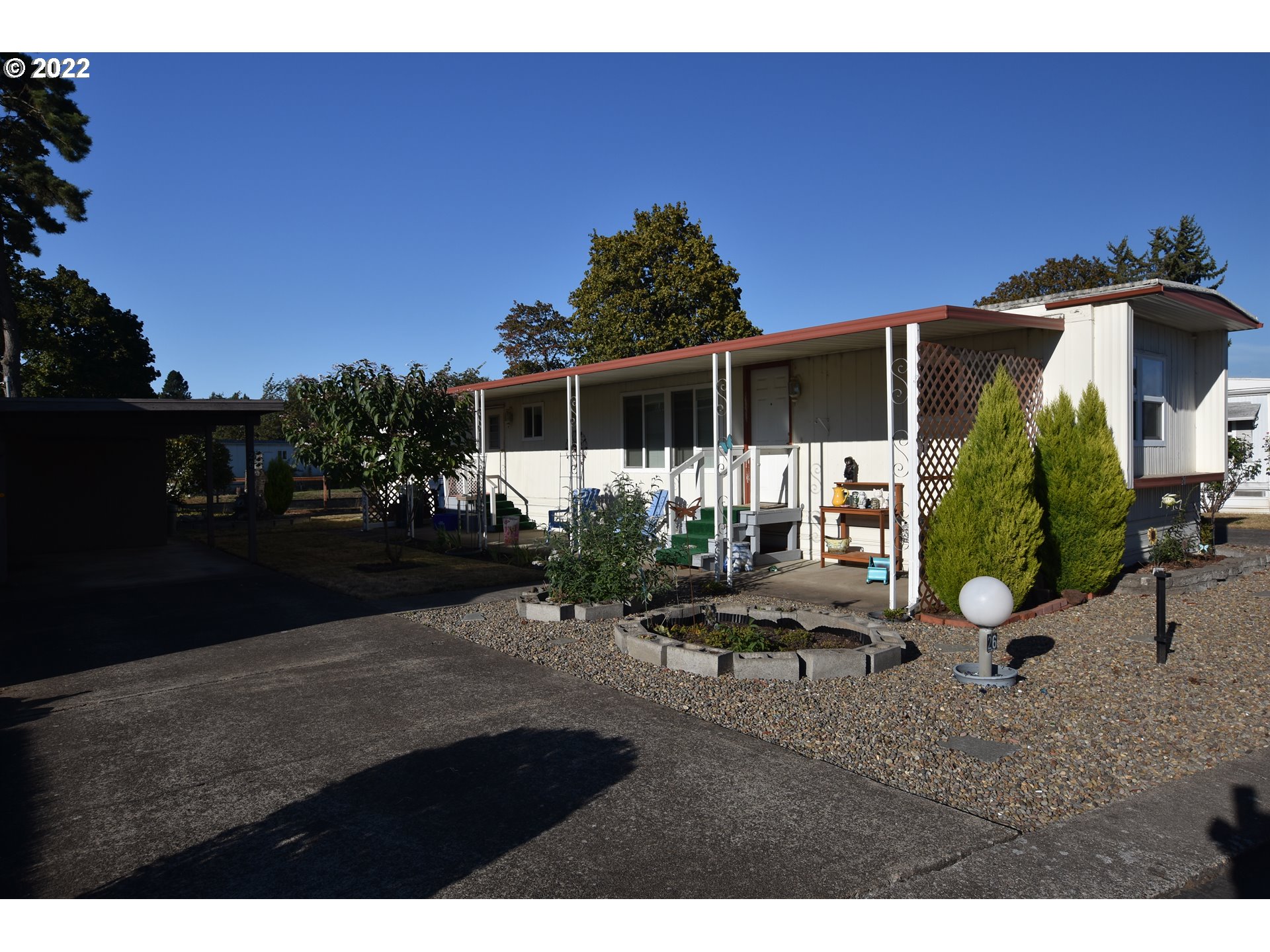 2150 Laura Street, Unit 26 Springfield, OR 97477 - Photo 1 of 26 a view of backyard with deck and seating space