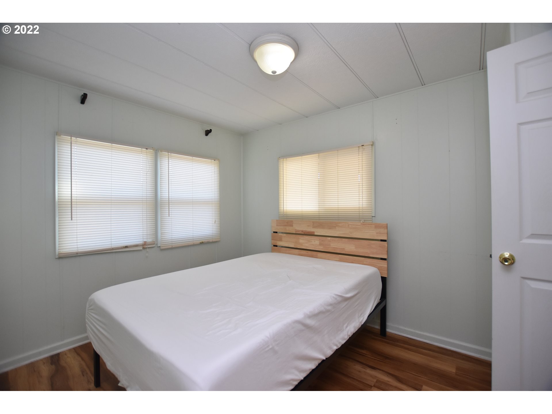 2150 Laura Street, Unit 26 Springfield, OR 97477 - Photo 11 of 26 a bedroom with a bed and window