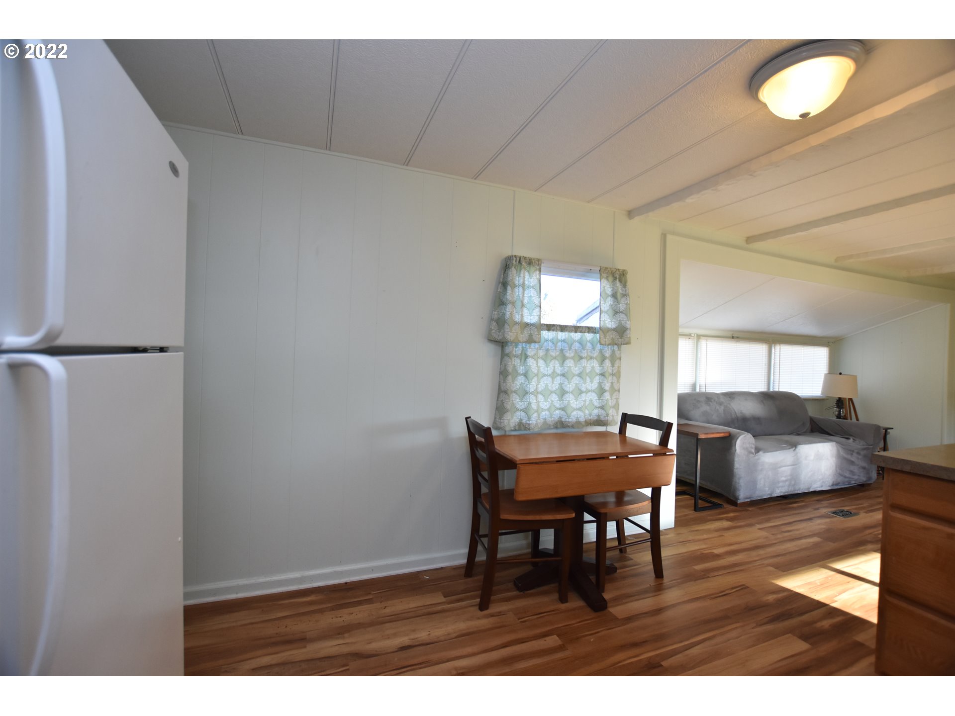 2150 Laura Street, Unit 26 Springfield, OR 97477 - Photo 17 of 26 a view of a dining room with furniture and window