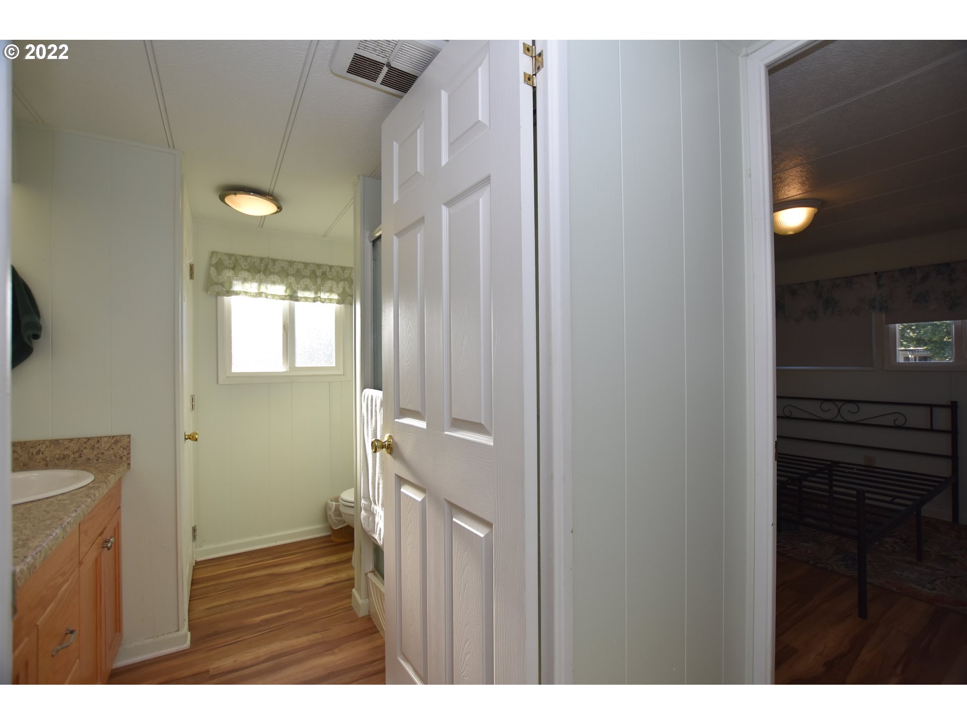 2150 Laura Street, Unit 26 Springfield, OR 97477 - Photo 19 of 26 a view of a hallway with wooden floor and staircase