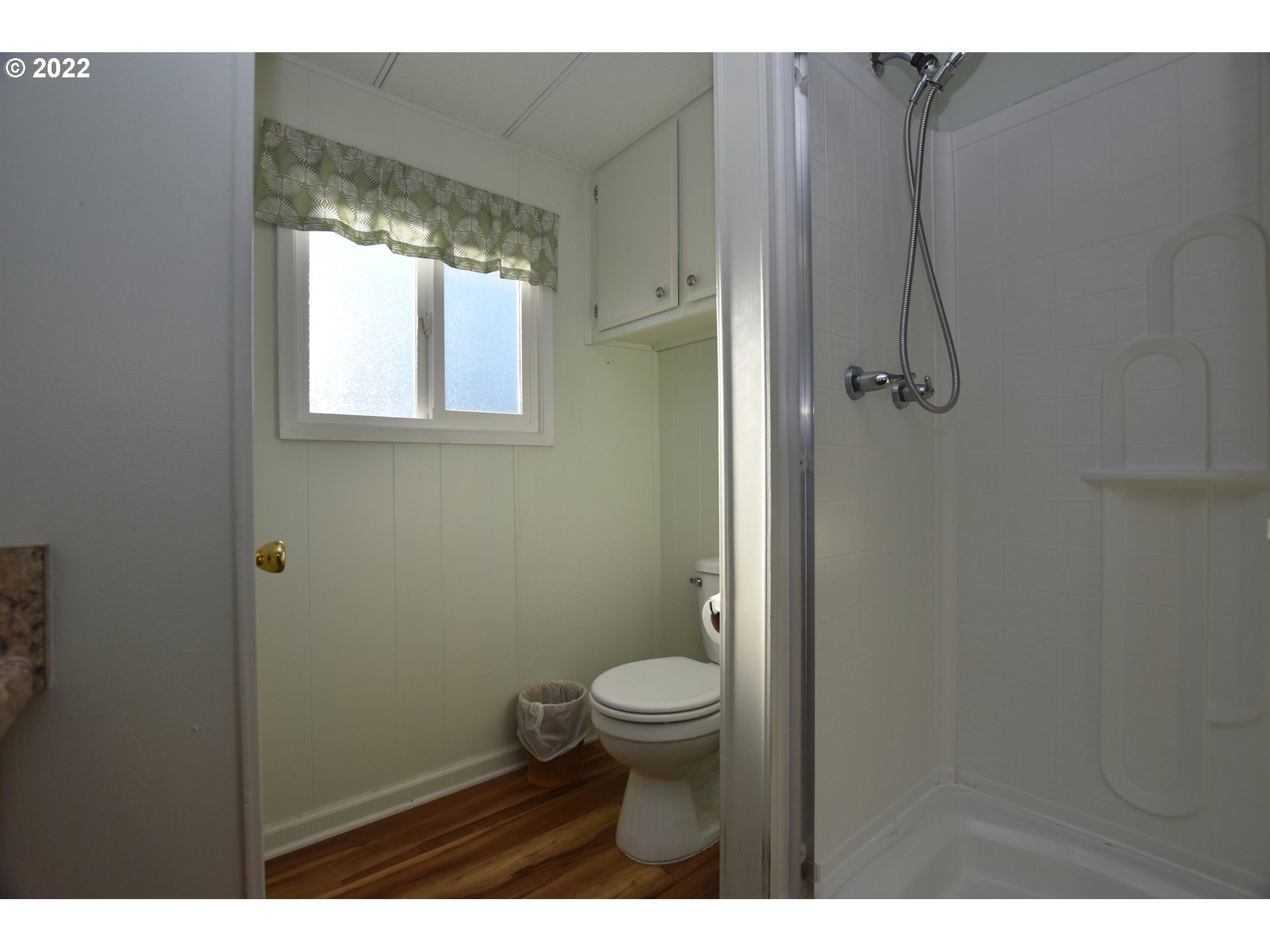 2150 Laura Street, Unit 26 Springfield, OR 97477 - Photo 21 of 26 a bathroom with a granite countertop toilet and a shower