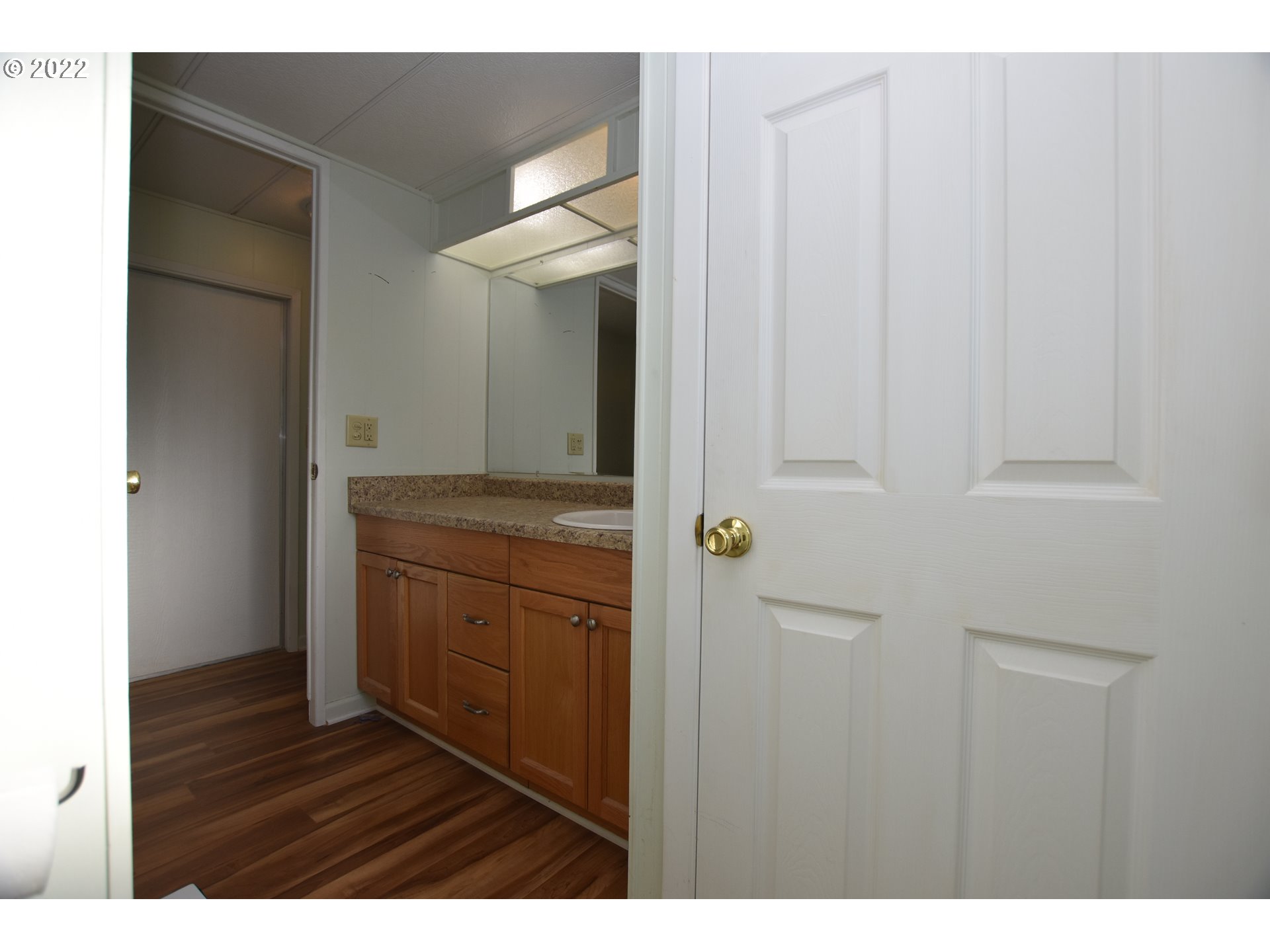 2150 Laura Street, Unit 26 Springfield, OR 97477 - Photo 22 of 26 a bathroom with a sink and a mirror