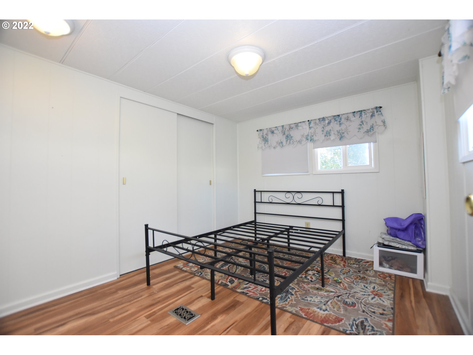 2150 Laura Street, Unit 26 Springfield, OR 97477 - Photo 23 of 26 a living room with furniture and a wooden floor