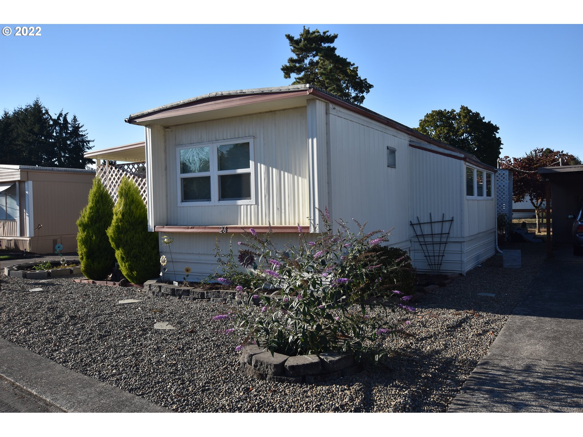 2150 Laura Street, Unit 26 Springfield, OR 97477 - Photo 25 of 26 a front view of a house with garden