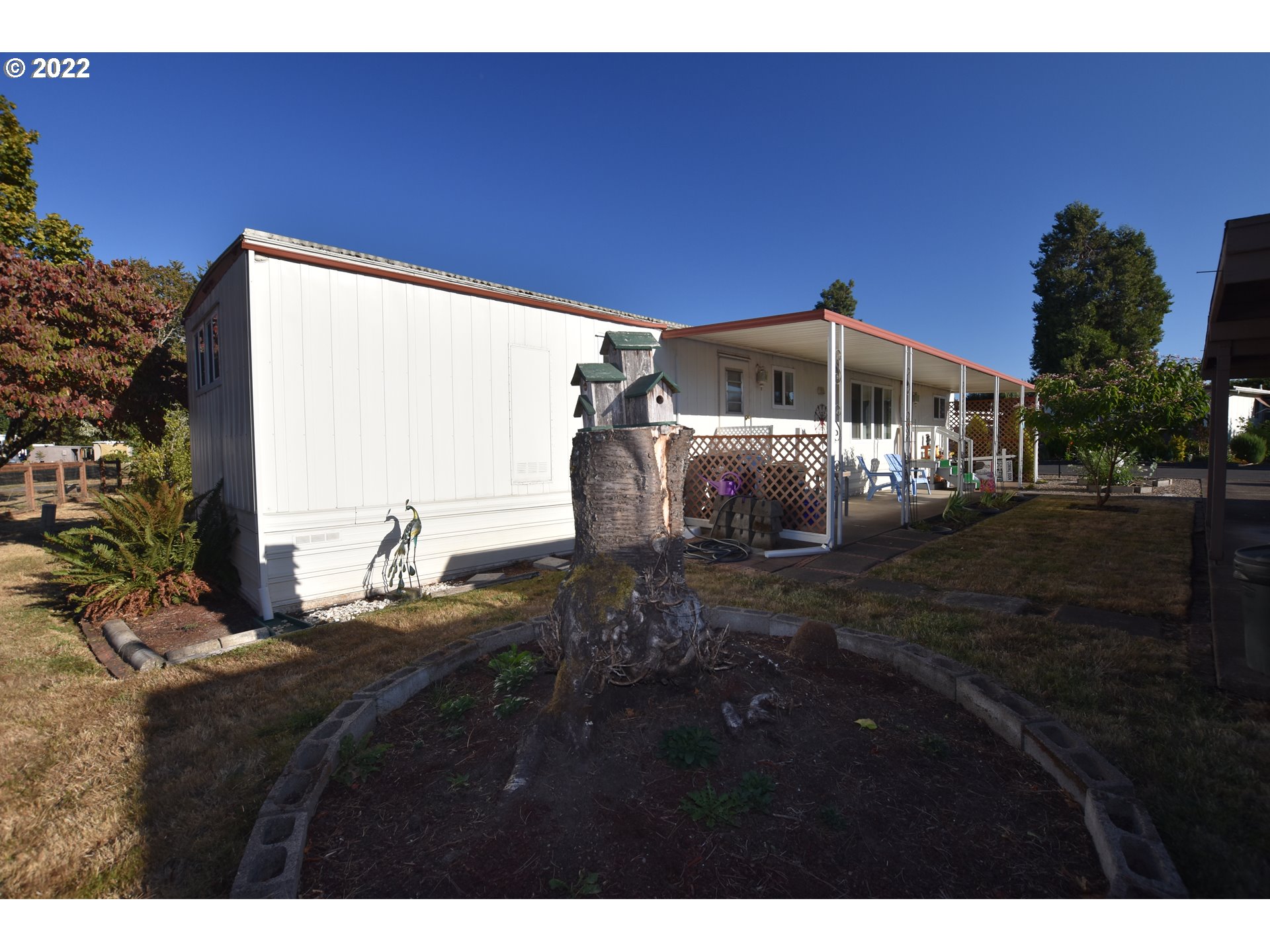 2150 Laura Street, Unit 26 Springfield, OR 97477 - Photo 4 of 26 a front view of a house with a yard