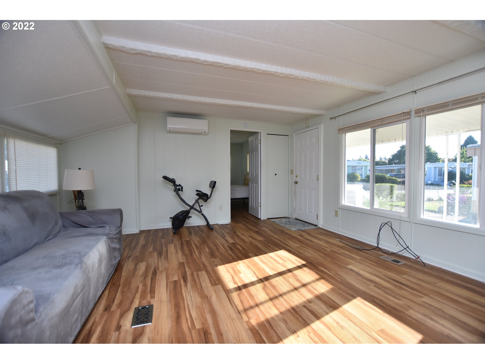 2150 Laura Street, Unit 26 Springfield, OR 97477 - Photo 6 of 26 a bedroom with a bed and wooden floor