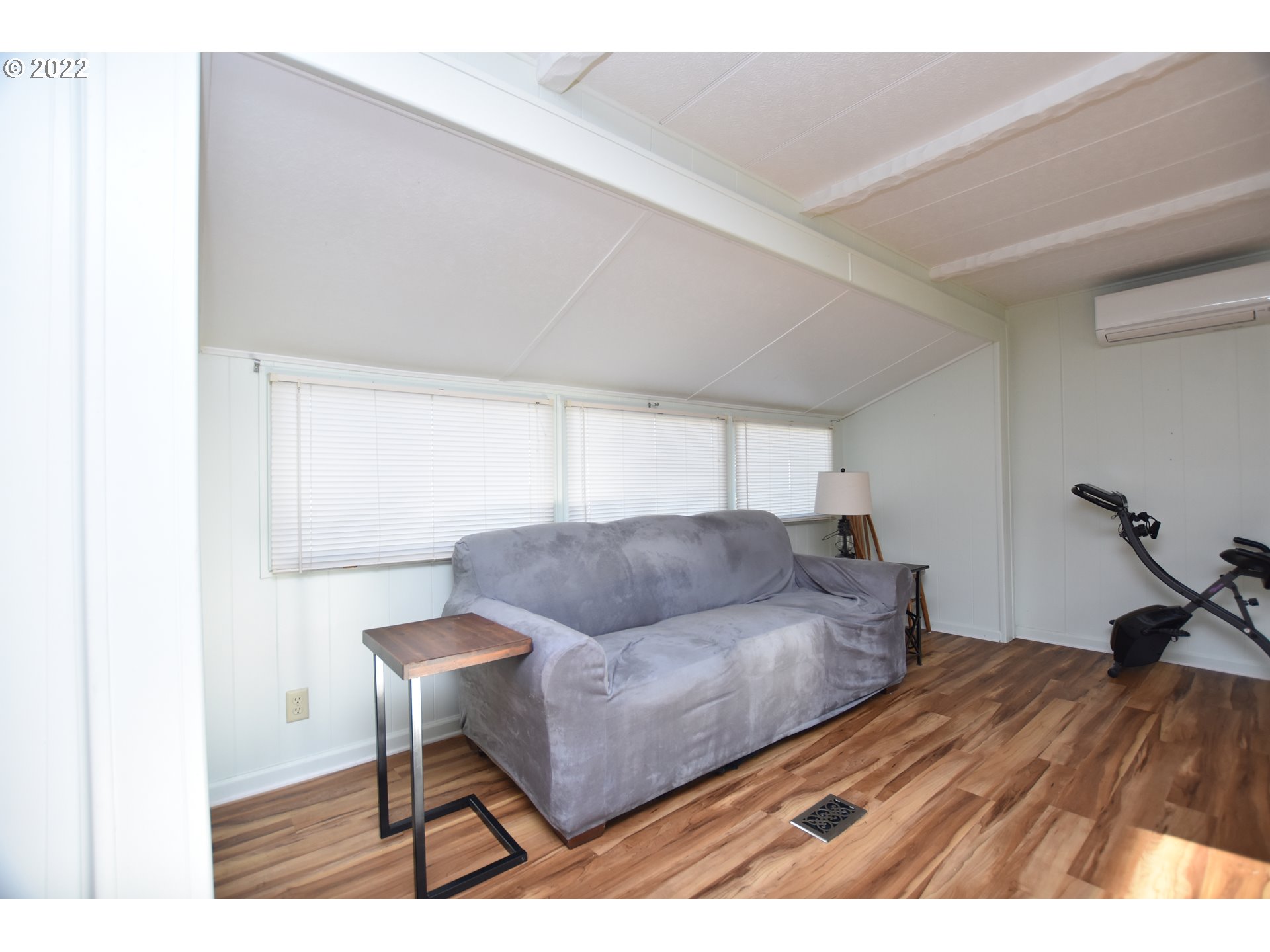 2150 Laura Street, Unit 26 Springfield, OR 97477 - Photo 7 of 26 a living room with furniture and a wooden floor
