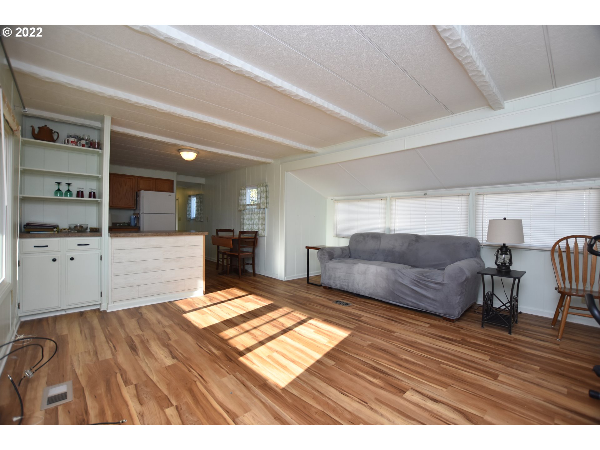 2150 Laura Street, Unit 26 Springfield, OR 97477 - Photo 8 of 26 a living room with furniture and a wooden floor