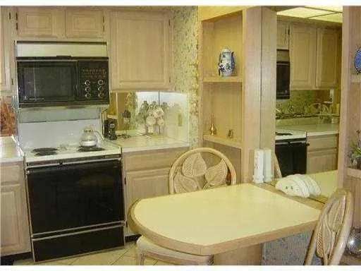 a bathroom with a sink a bathtub and a mirror