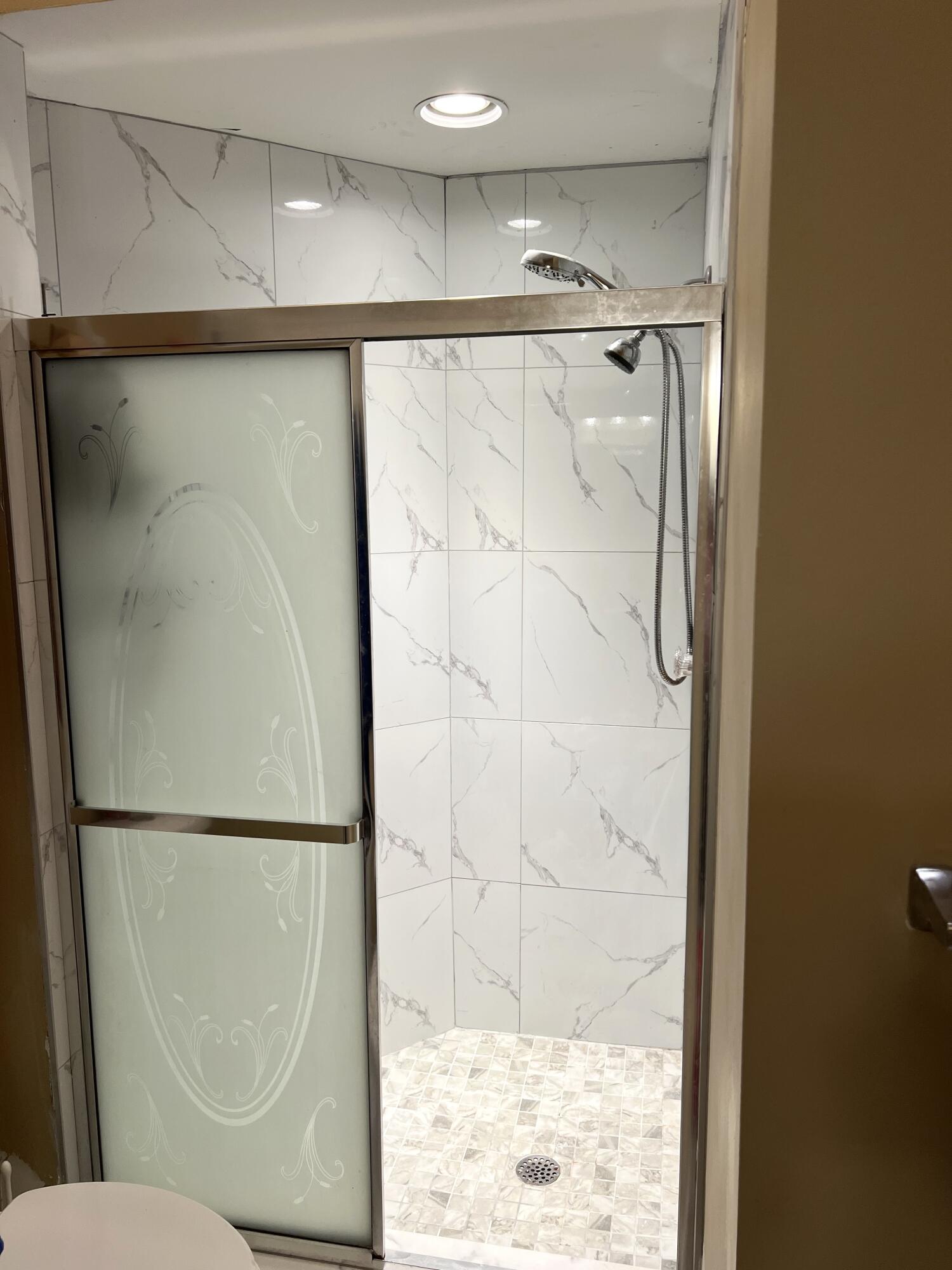 9416 Boca River Circle, Unit 9416 Boca Raton, FL 33434 - Photo 15 of 34 a bathroom with a shower and a toilet