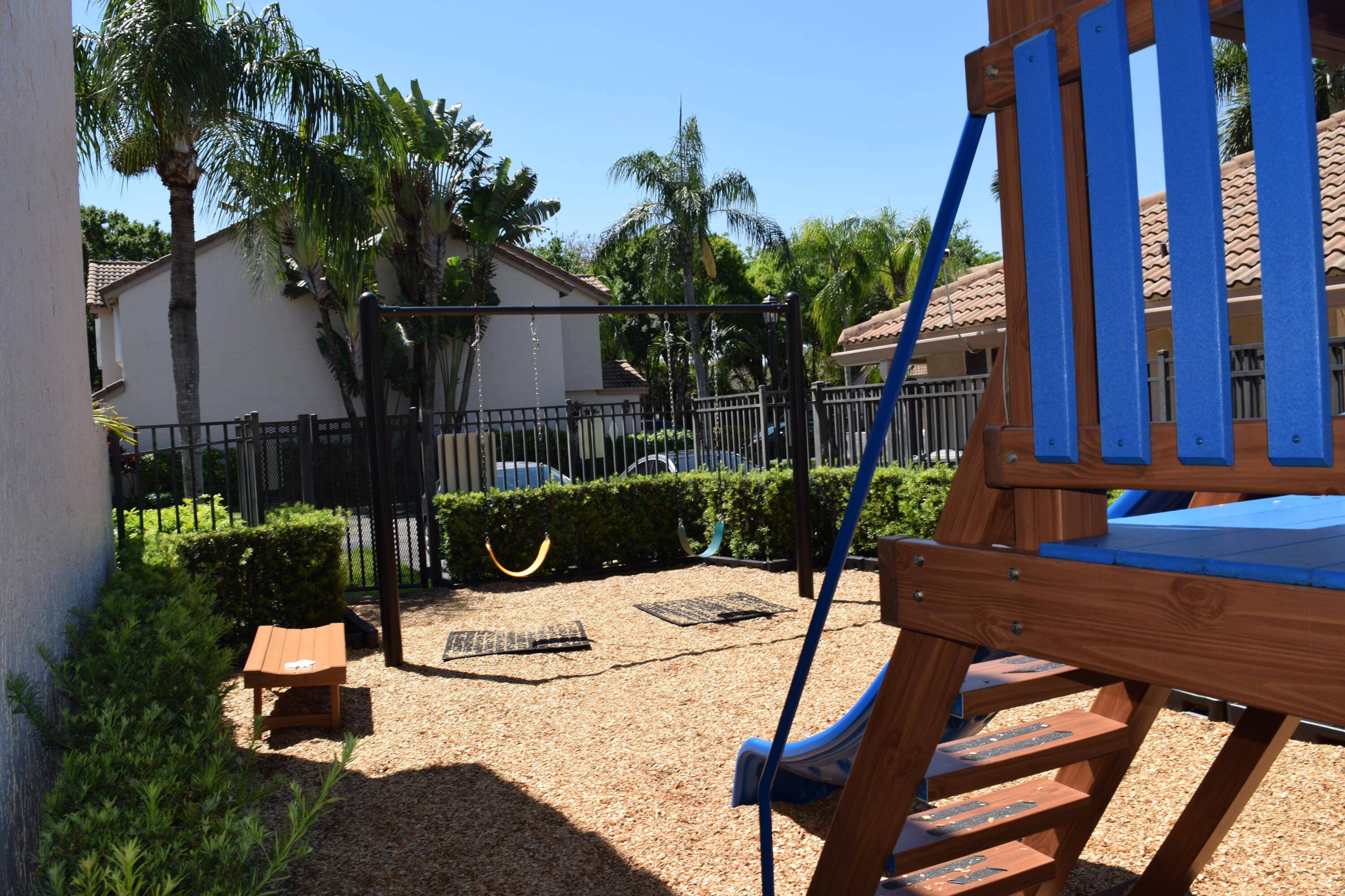 9416 Boca River Circle, Unit 9416 Boca Raton, FL 33434 - Photo 29 of 34 a view of an chairs and table in the patio