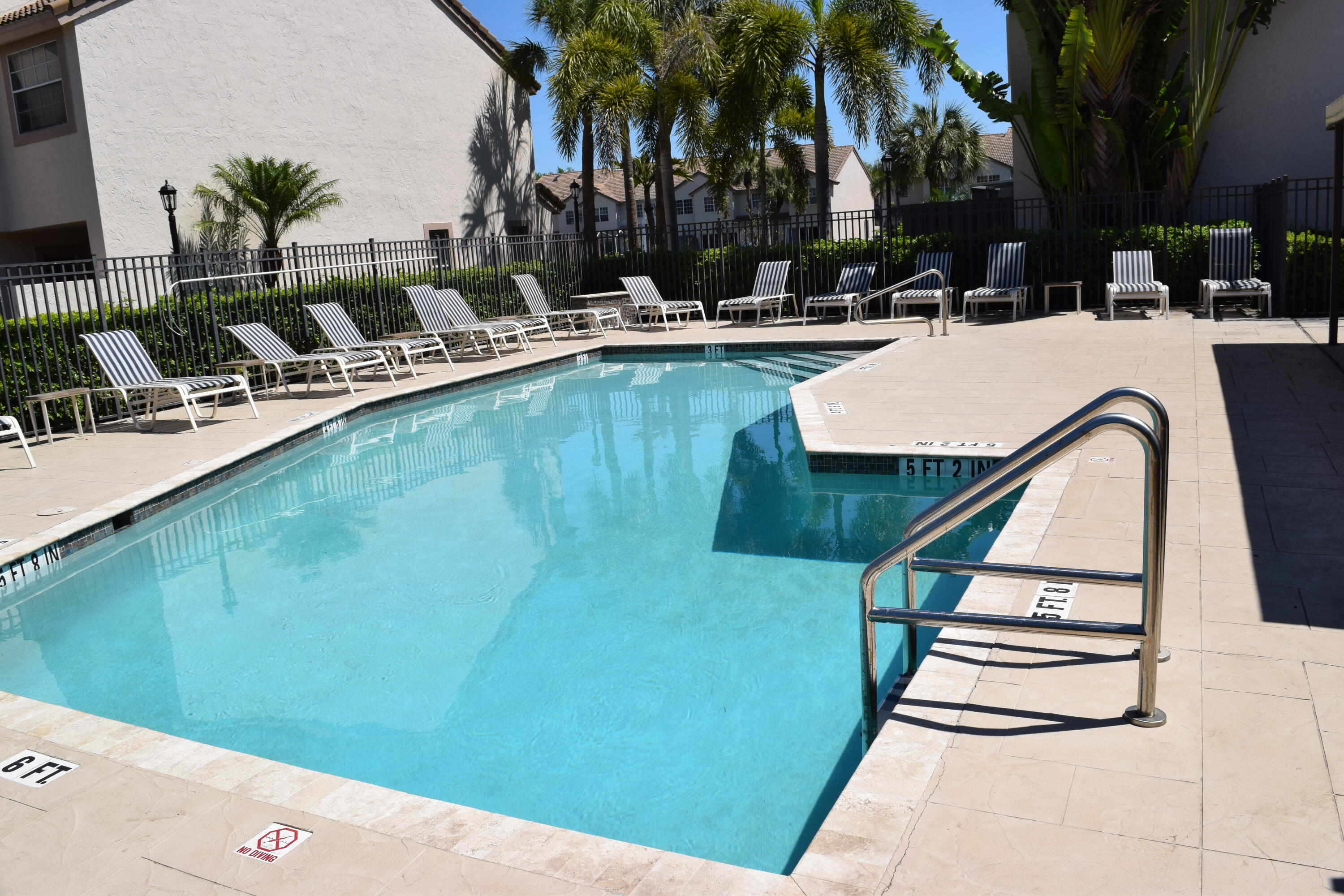 9416 Boca River Circle, Unit 9416 Boca Raton, FL 33434 - Photo 31 of 34 a view of a backyard with swimming pool and sitting area